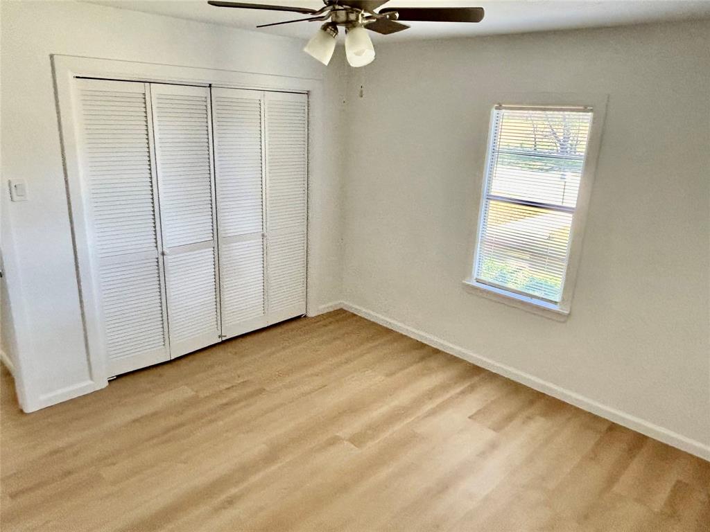 607 Baylor Street Nocona, TX 76255 - Photo 3 of 17 a view of an empty room with a window