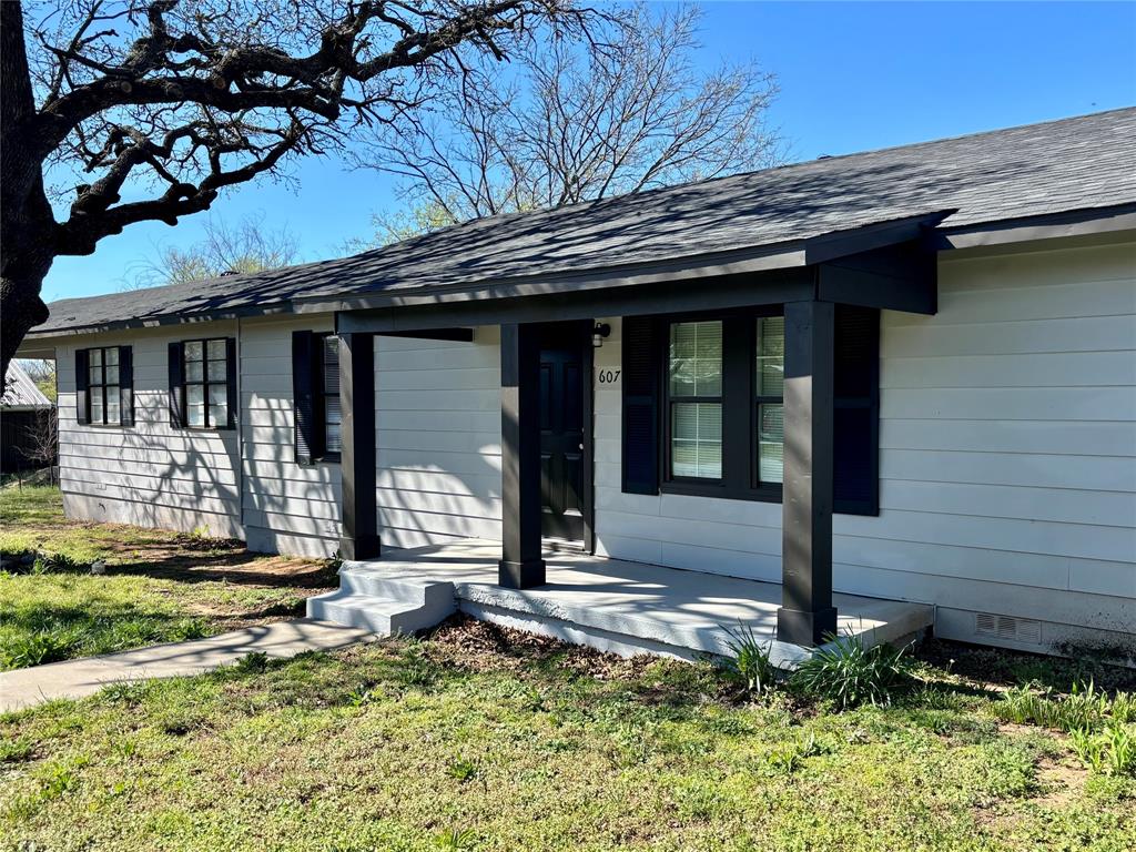 607 Baylor Street Nocona, TX 76255 - Photo 6 of 17 a view of a house with potted plants
