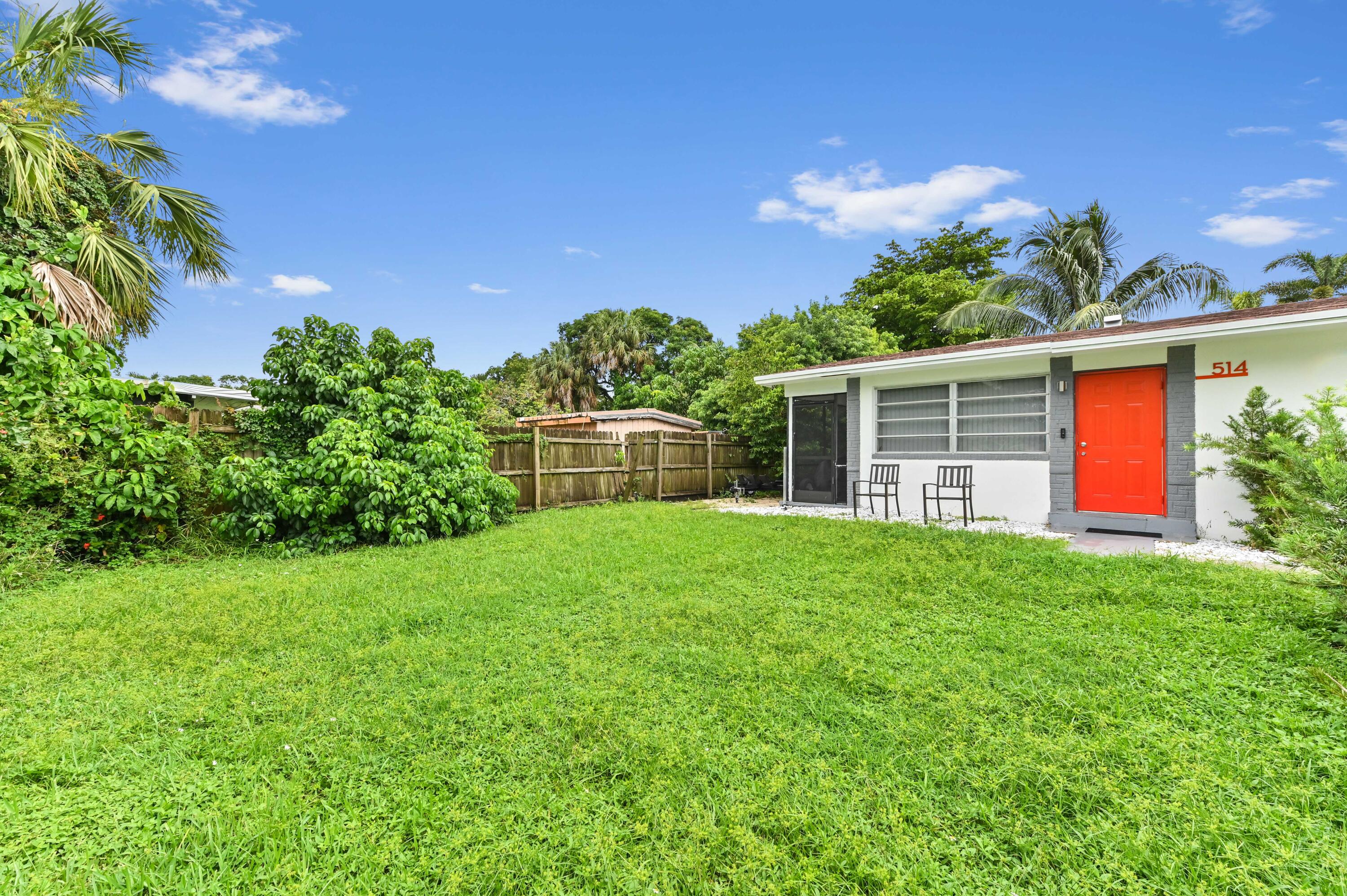 538 Southwest 7th Street Hallandale Beach, FL 33009 - Photo 12 of 35 a backyard of a house with lots of green space