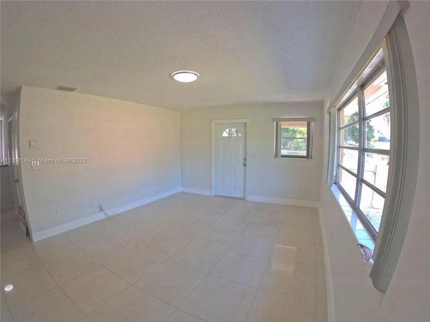 538 Southwest 7th Street Hallandale Beach, FL 33009 - Photo 24 of 35 a view of an empty room with a window