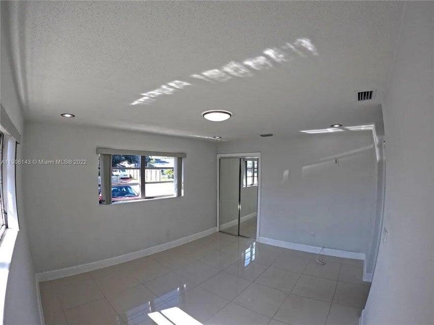 538 Southwest 7th Street Hallandale Beach, FL 33009 - Photo 26 of 35 a view of an empty room with window and bathroom
