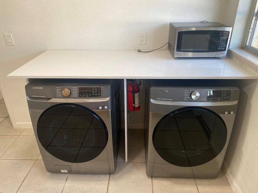 538 Southwest 7th Street Hallandale Beach, FL 33009 - Photo 30 of 35 a utility room with dryer and washer