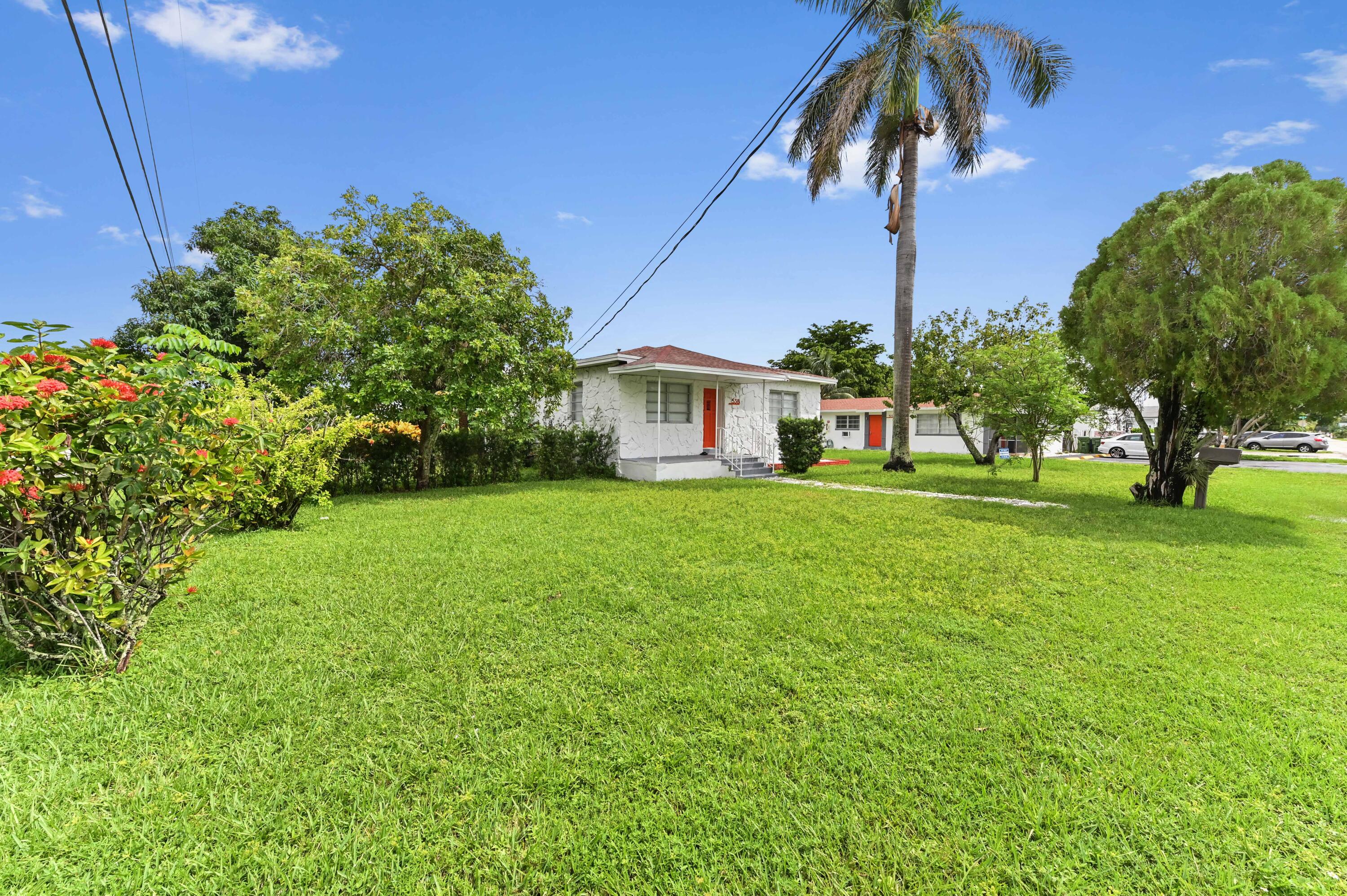 538 Southwest 7th Street Hallandale Beach, FL 33009 - Photo 3 of 35 a house view with a garden space