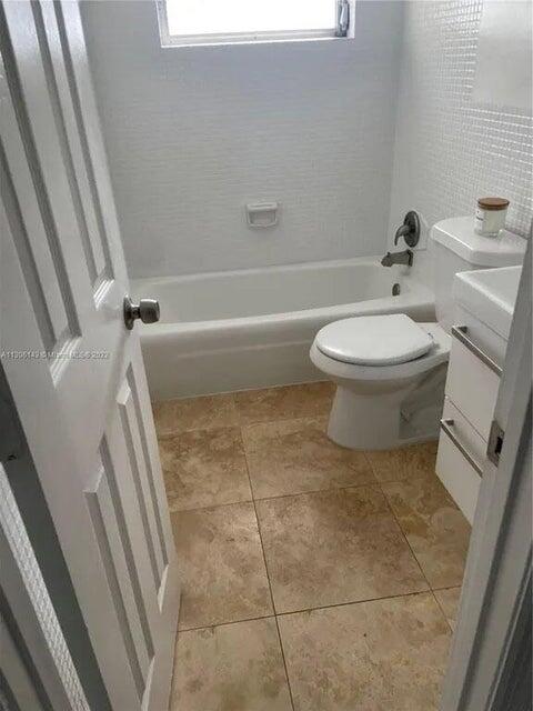 538 Southwest 7th Street Hallandale Beach, FL 33009 - Photo 33 of 35 a bathroom with a toilet and a shower
