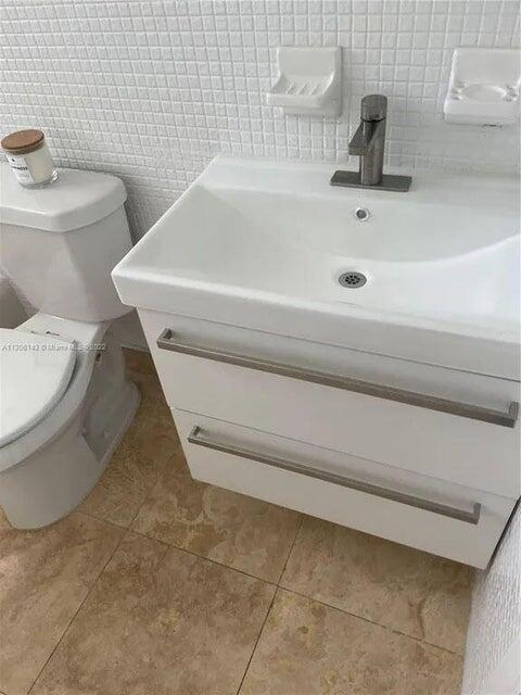 538 Southwest 7th Street Hallandale Beach, FL 33009 - Photo 35 of 35 a bathroom with a sink and a toilet