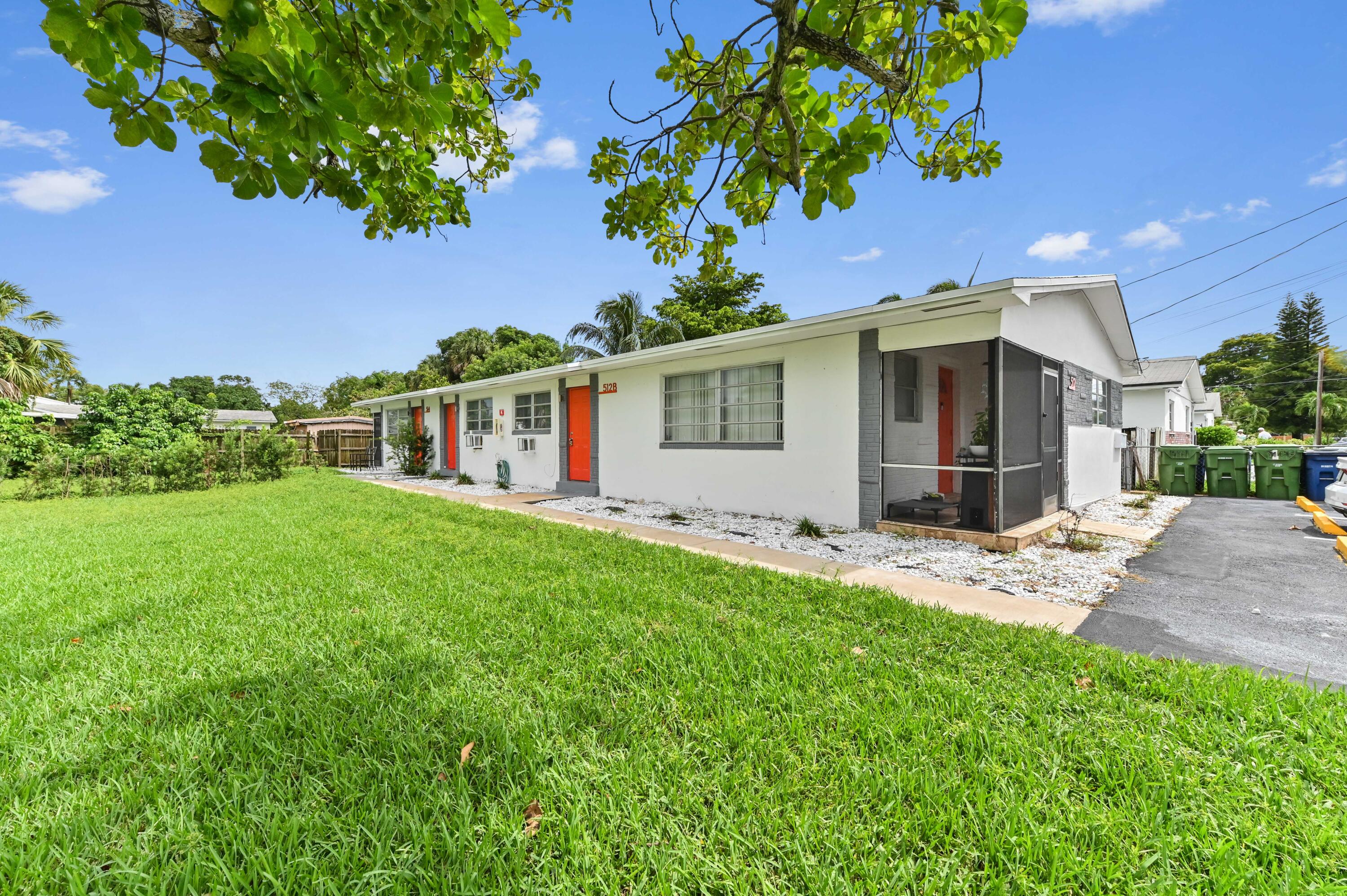538 Southwest 7th Street Hallandale Beach, FL 33009 - Photo 5 of 35 a front view of house with yard and green space