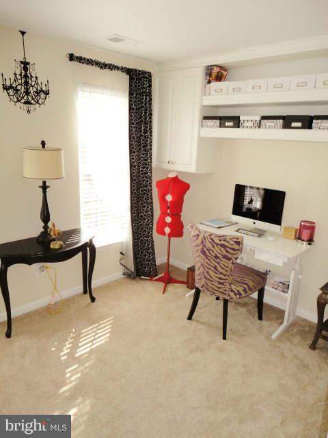 43396 Edgewater Street Chantilly, VA 20152 - Photo 12 of 16 a living room with furniture and a window