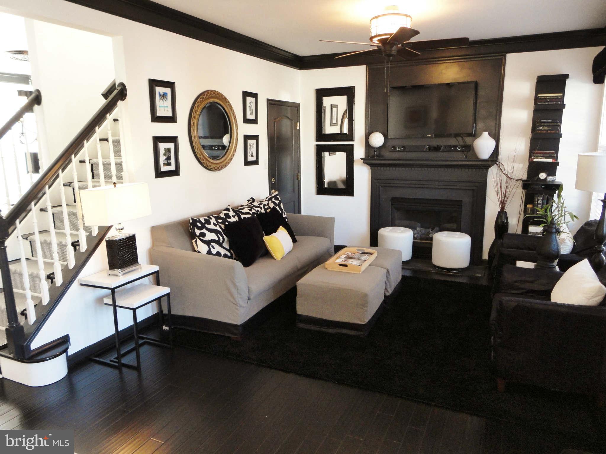 43396 Edgewater Street Chantilly, VA 20152 - Photo 6 of 16 a living room with fireplace furniture and a wooden floor