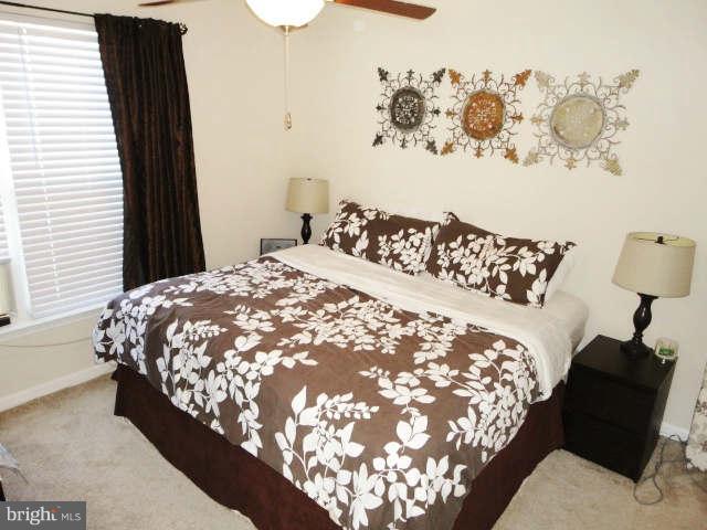 43396 Edgewater Street Chantilly, VA 20152 - Photo 10 of 16 a bed sitting in a bedroom next to a window