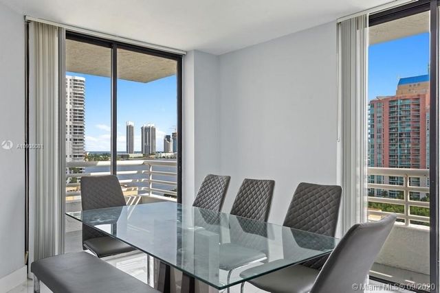 a view of a dining room with furniture window and outside view