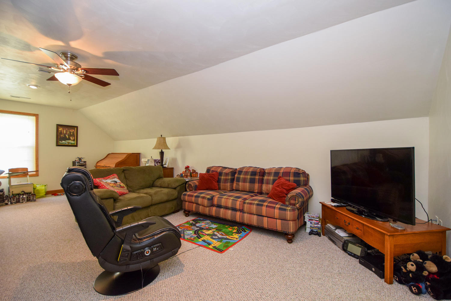 213 W Road Blue Ridge, VA 24064 - Photo 23 of 51 a living room with furniture a flat screen tv and a couch