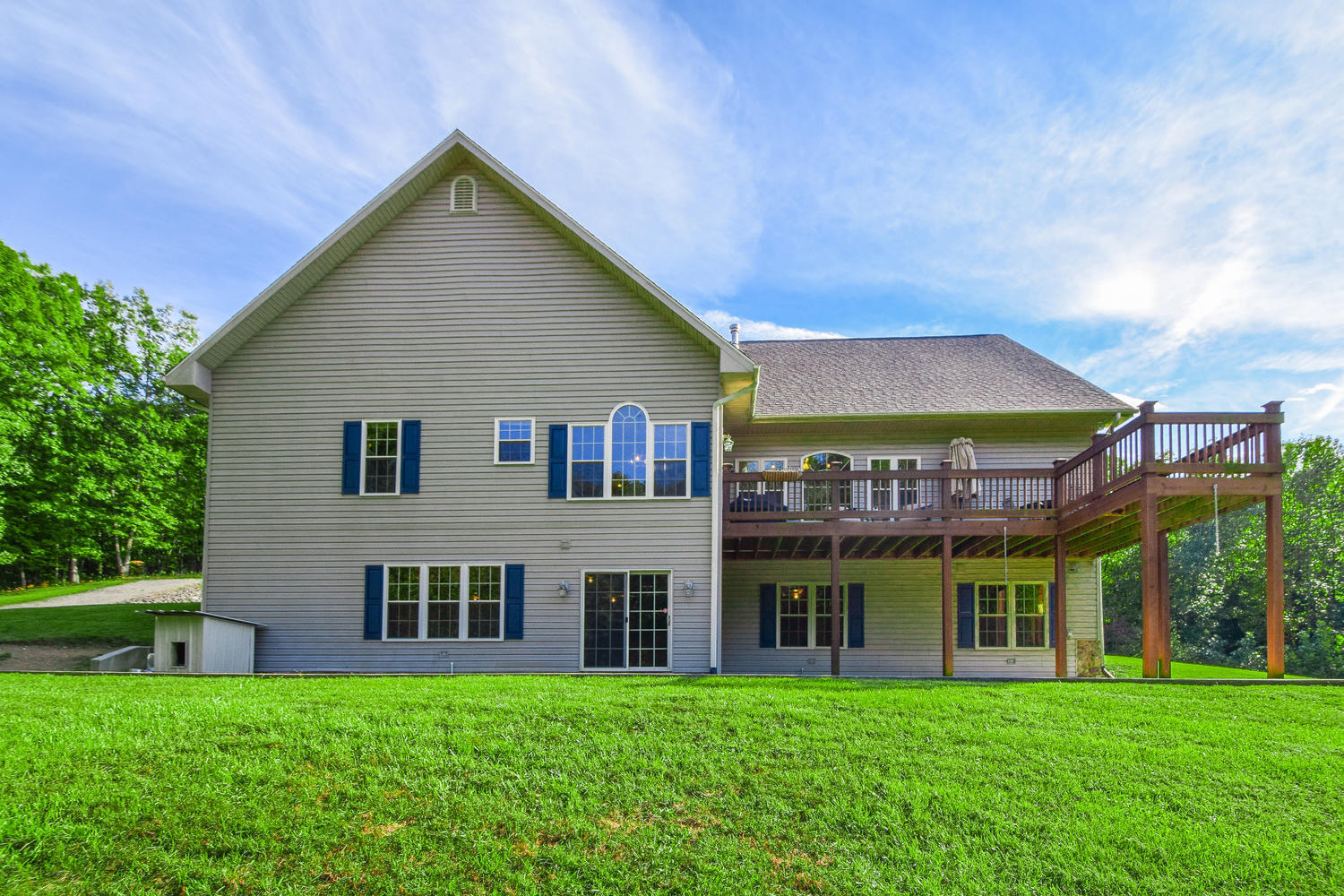 213 W Road Blue Ridge, VA 24064 - Photo 27 of 51 a view of a white house with a big yard and potted plants and large trees