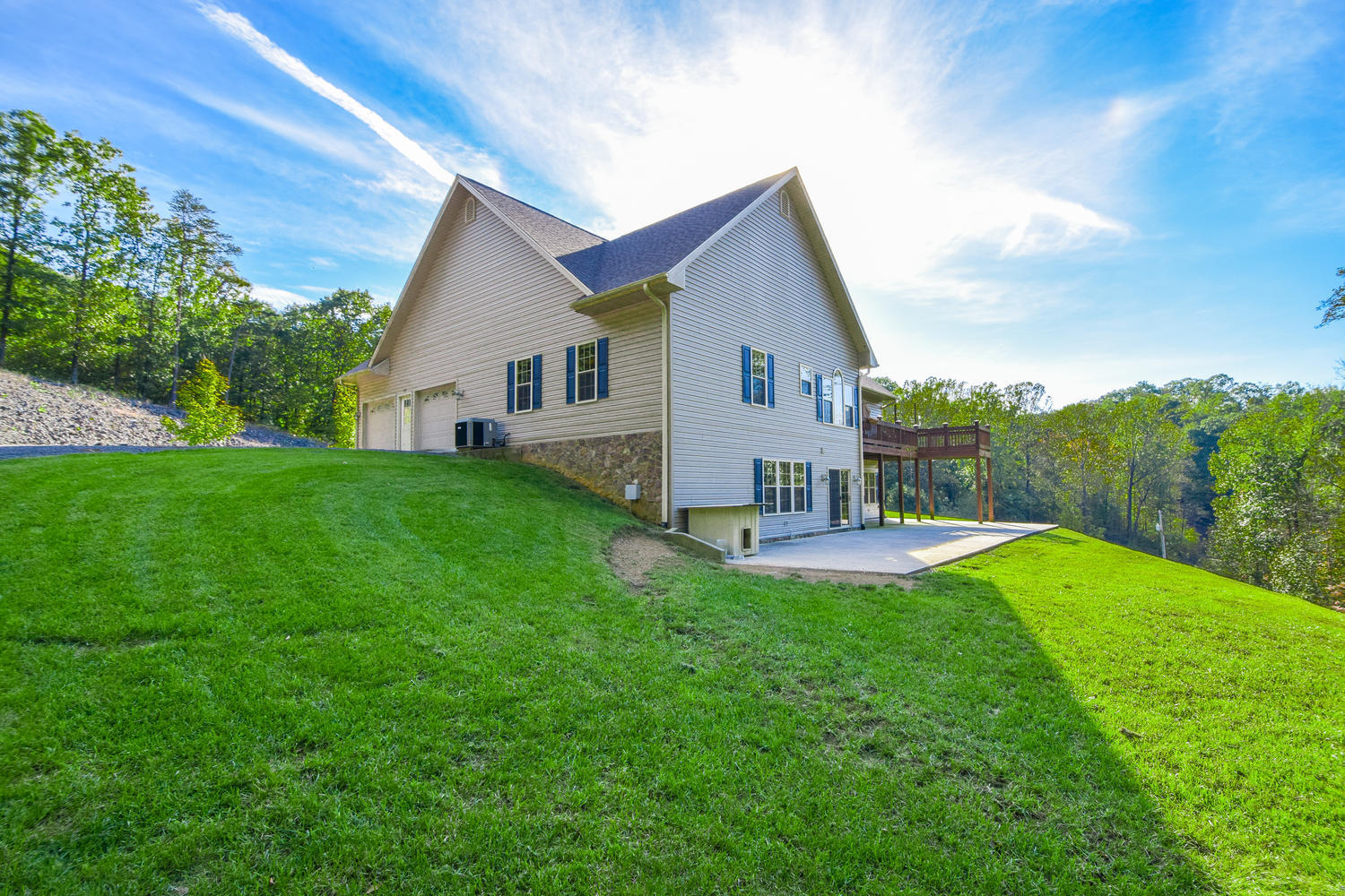 213 W Road Blue Ridge, VA 24064 - Photo 29 of 51 a view of a house with a yard and deck