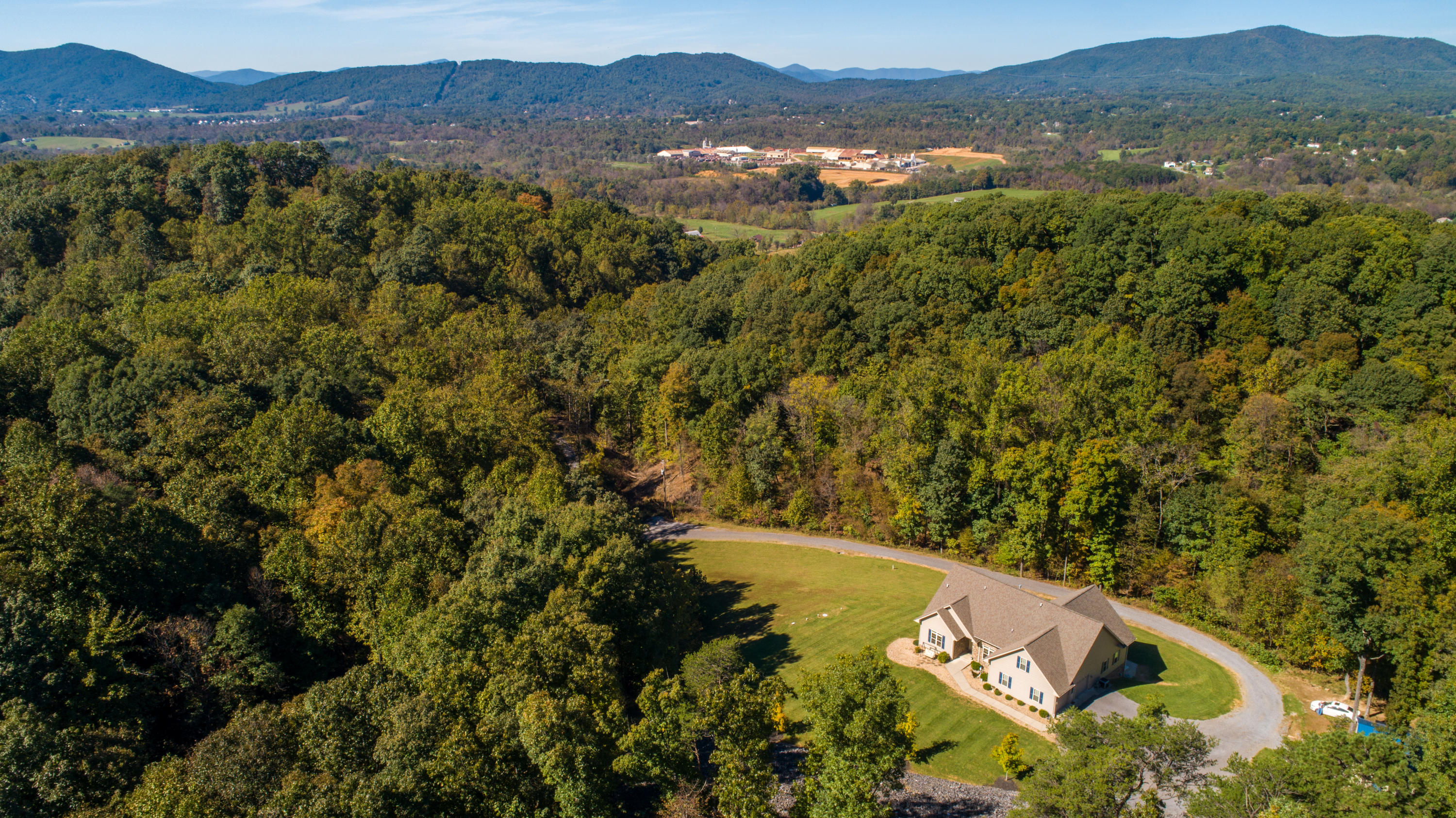 213 W Road Blue Ridge, VA 24064 - Photo 46 of 51 a view of a lush green hillside and houses