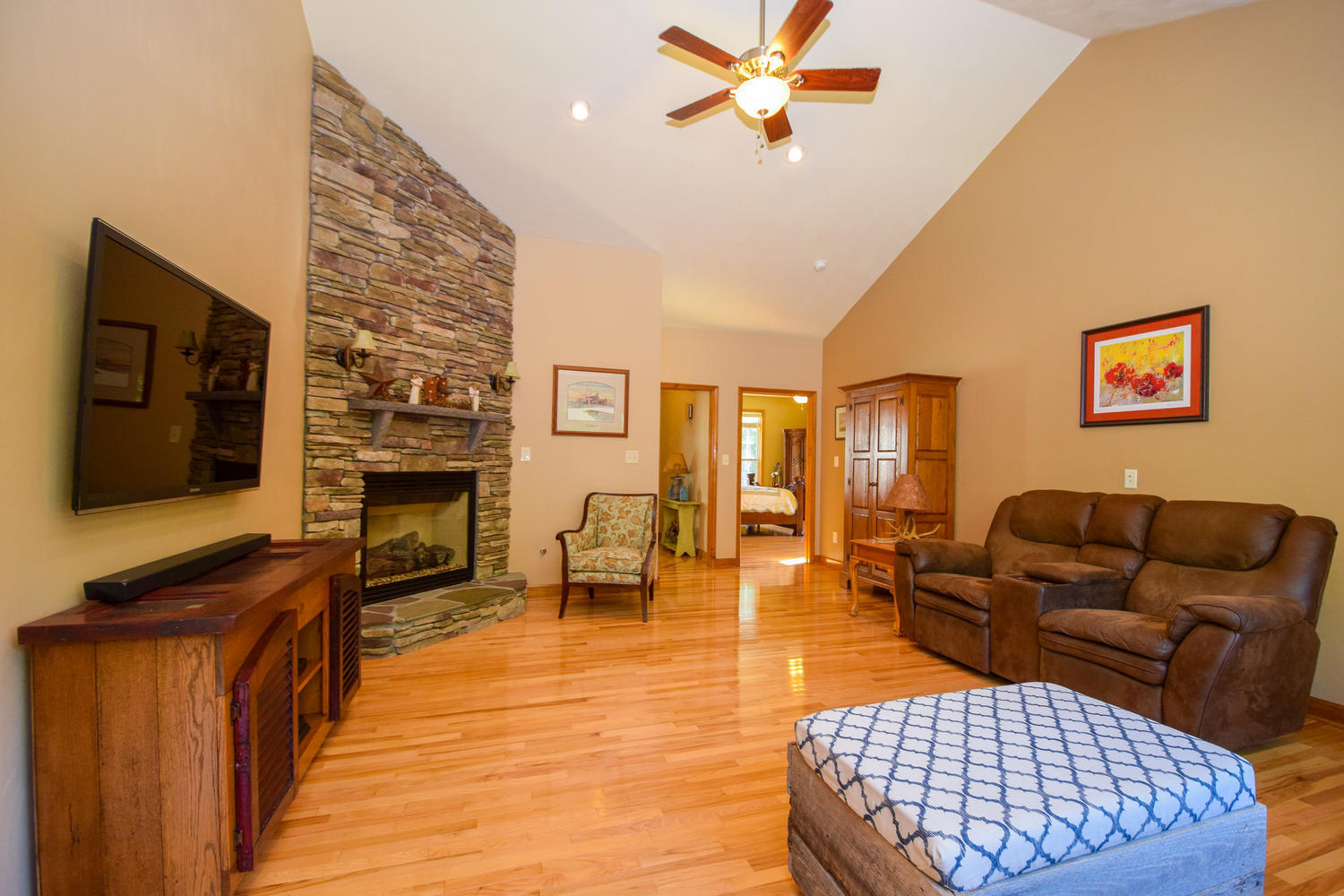 213 W Road Blue Ridge, VA 24064 - Photo 7 of 51 a living room with furniture a flat screen tv and a fireplace