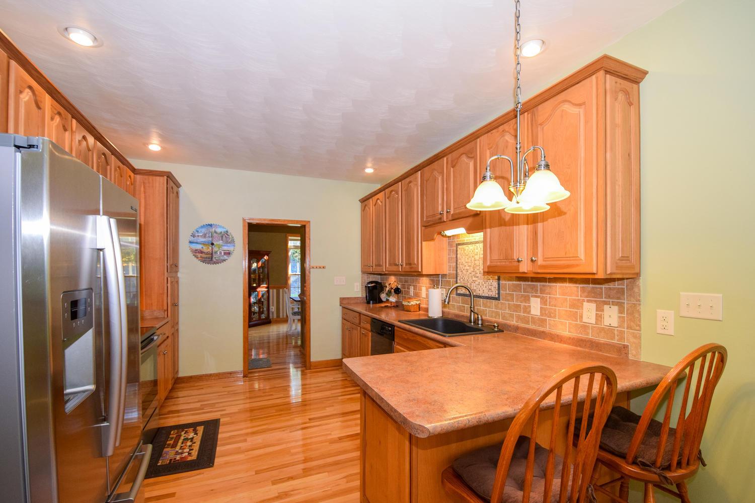 213 W Road Blue Ridge, VA 24064 - Photo 10 of 51 a kitchen with stainless steel appliances granite countertop a refrigerator a stove and a dining table with wooden floor