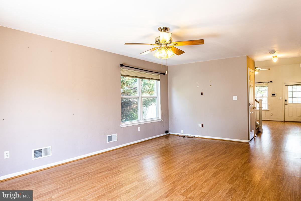 2 Kimberly Drive Middletown, DE 19709 - Photo 11 of 32 an empty room with wooden floor and windows