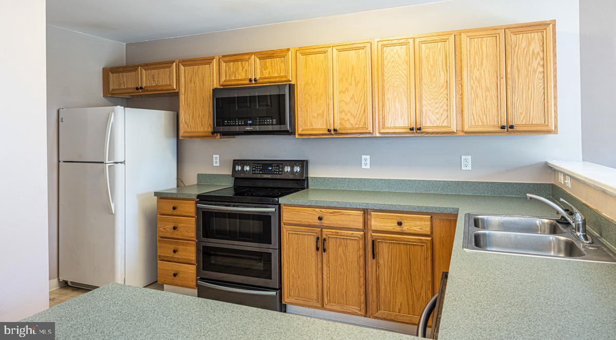 2 Kimberly Drive Middletown, DE 19709 - Photo 12 of 32 a kitchen with stainless steel appliances a stove and a refrigerator