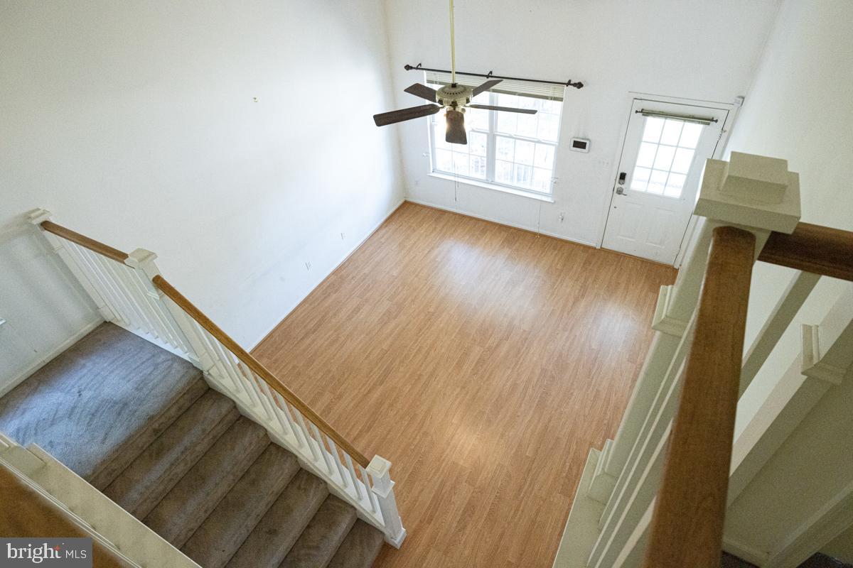 2 Kimberly Drive Middletown, DE 19709 - Photo 15 of 32 a view of a hallway with wooden floor and stairs