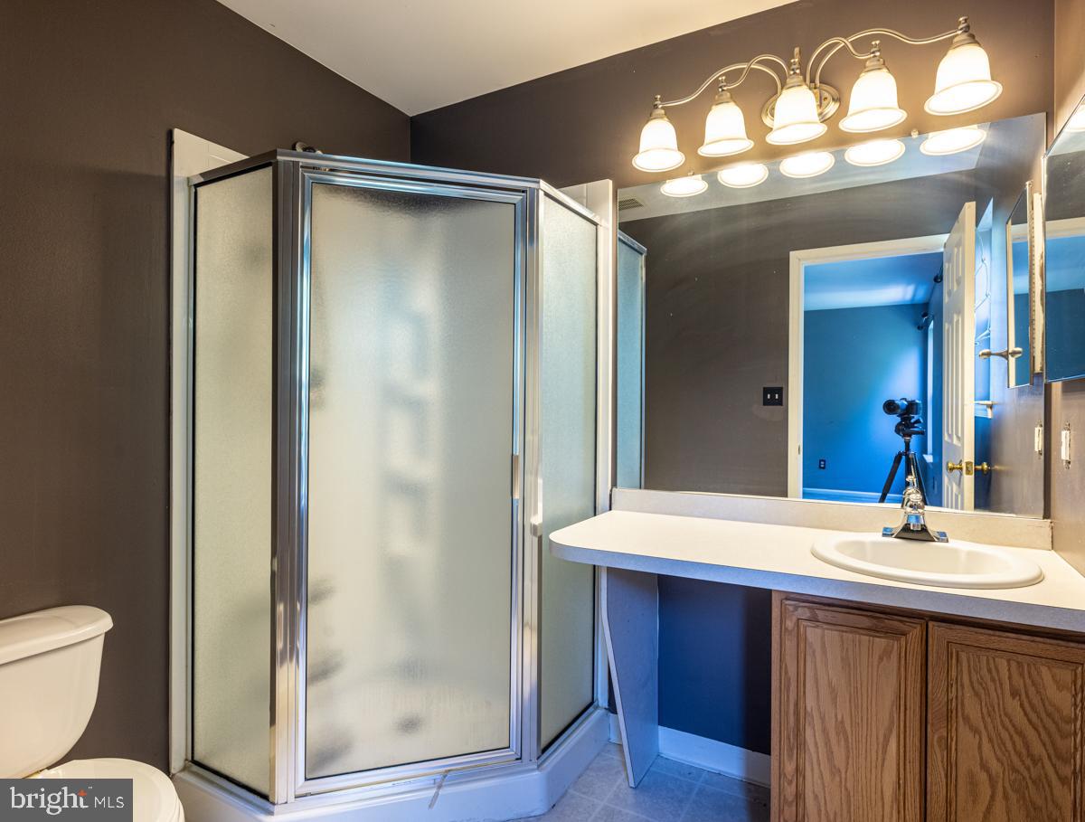 2 Kimberly Drive Middletown, DE 19709 - Photo 21 of 32 a bathroom with a sink and a mirror
