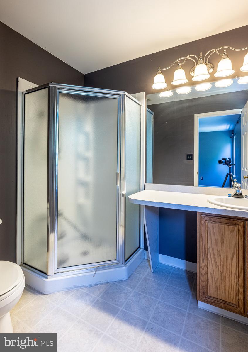 2 Kimberly Drive Middletown, DE 19709 - Photo 22 of 32 a bathroom with a sink and a large mirror