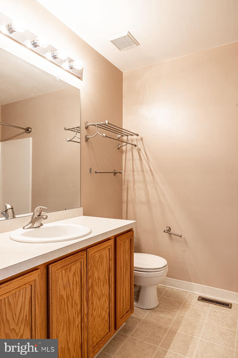 2 Kimberly Drive Middletown, DE 19709 - Photo 26 of 32 a bathroom with a sink a toilet and a mirror