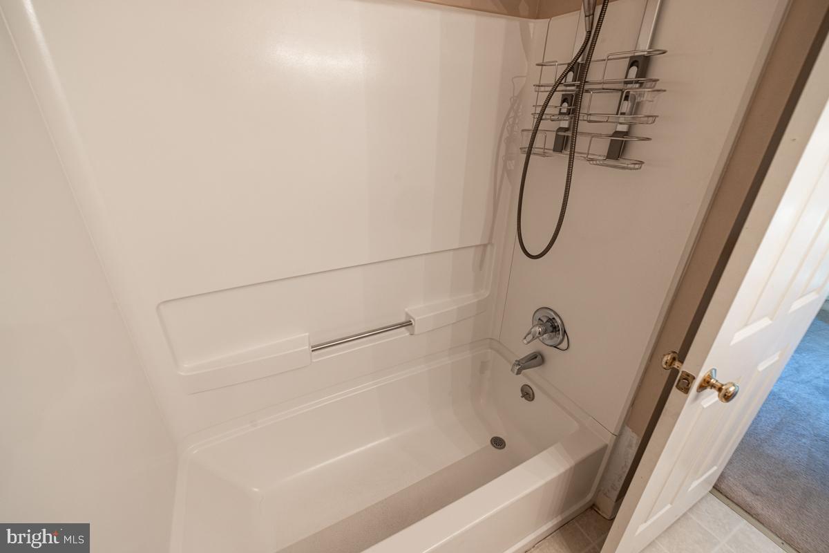 2 Kimberly Drive Middletown, DE 19709 - Photo 28 of 32 a bathroom with a bath tub with a shower