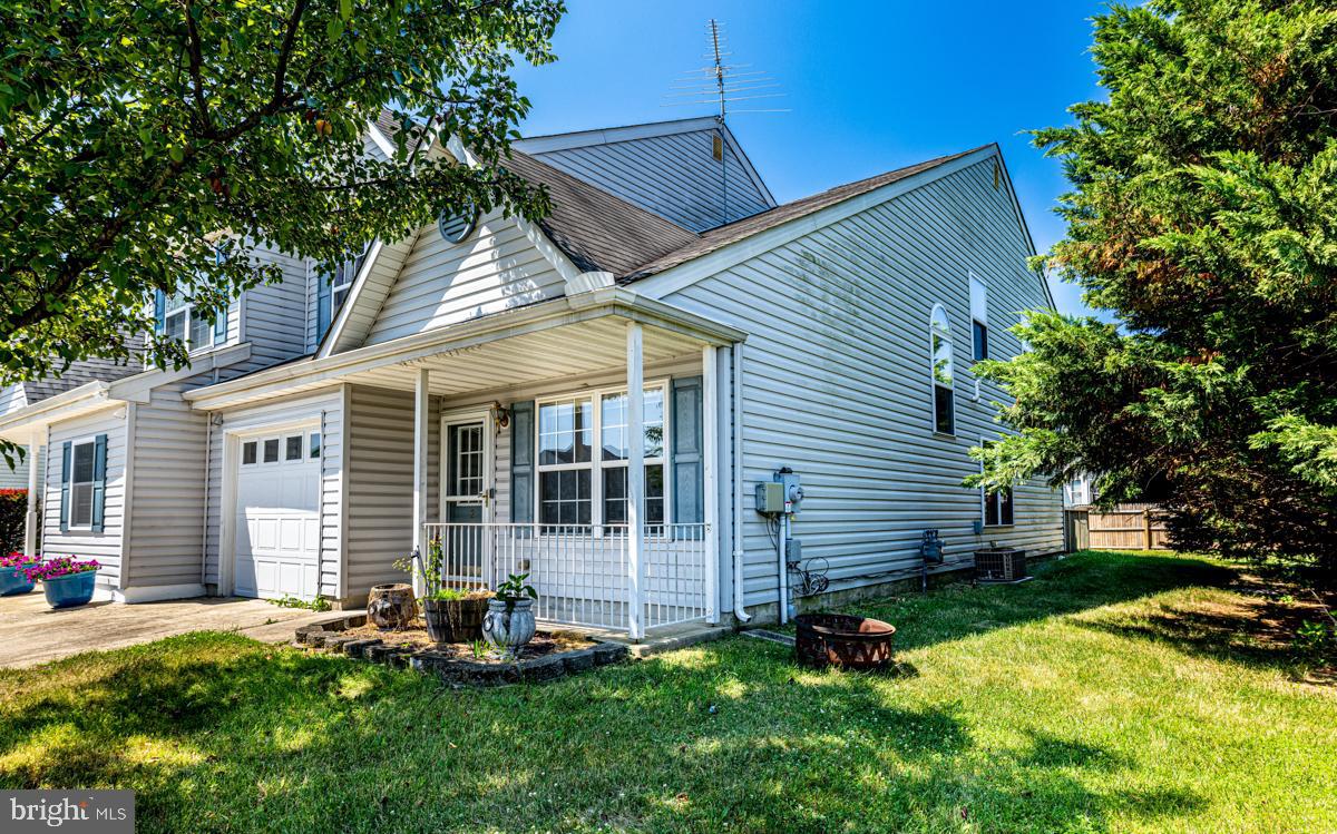 2 Kimberly Drive Middletown, DE 19709 - Photo 5 of 32 a backyard of a house with wooden fence and large tree