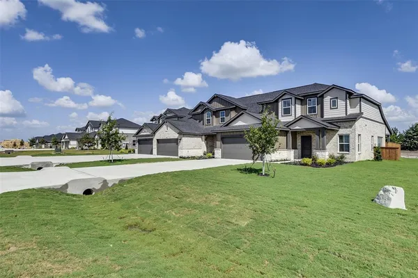 a view of a house with a big yard