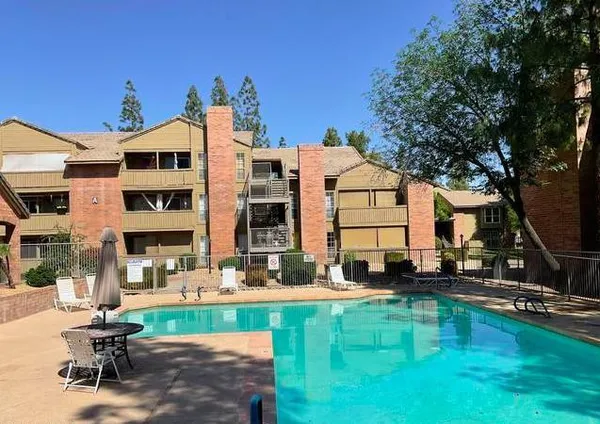 a view of pool with outdoor seating
