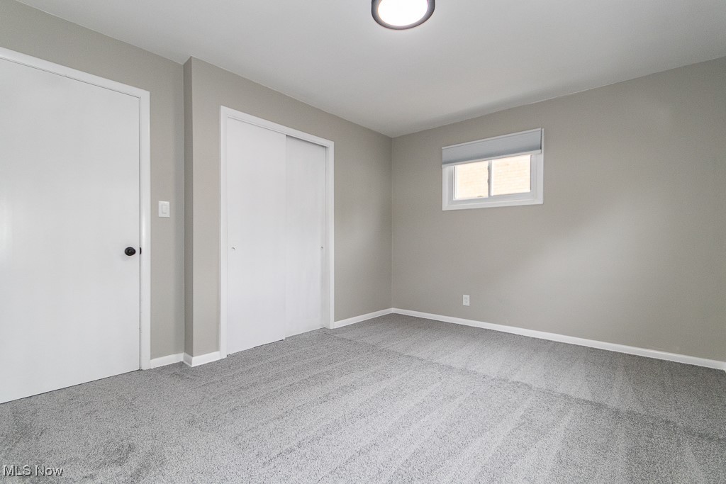 5683 Cherokee Road Cleveland, OH 44124 - Photo 19 of 35 Unfurnished bedroom with a closet and carpet