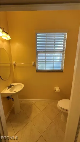 a view of a porch with wooden floor and outdoor seating