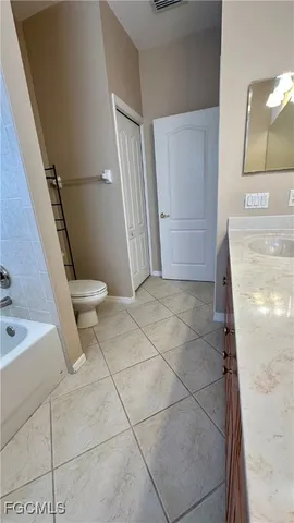a view of a room with wooden floor and chandelier