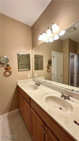 a bathroom with a sink and shower