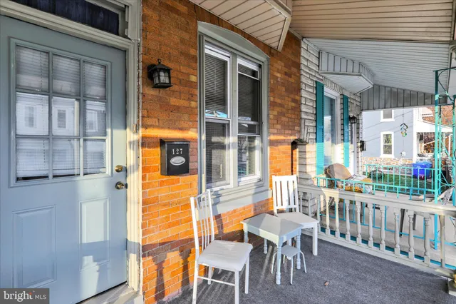 a view of a chair and table in the balcony