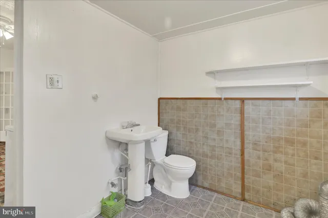 a bathroom with a sink a toilet