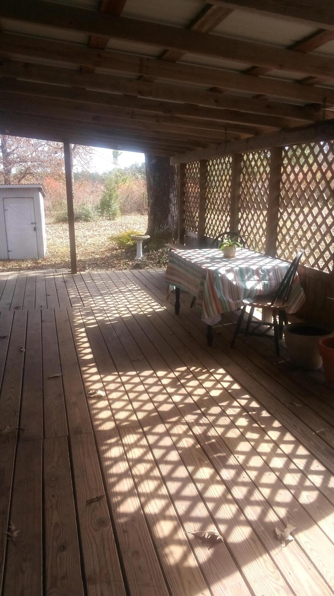 7363 Beaver Creek Road Baker, FL 32531 - Photo 27 of 29 a view of outdoor space with wooden floor