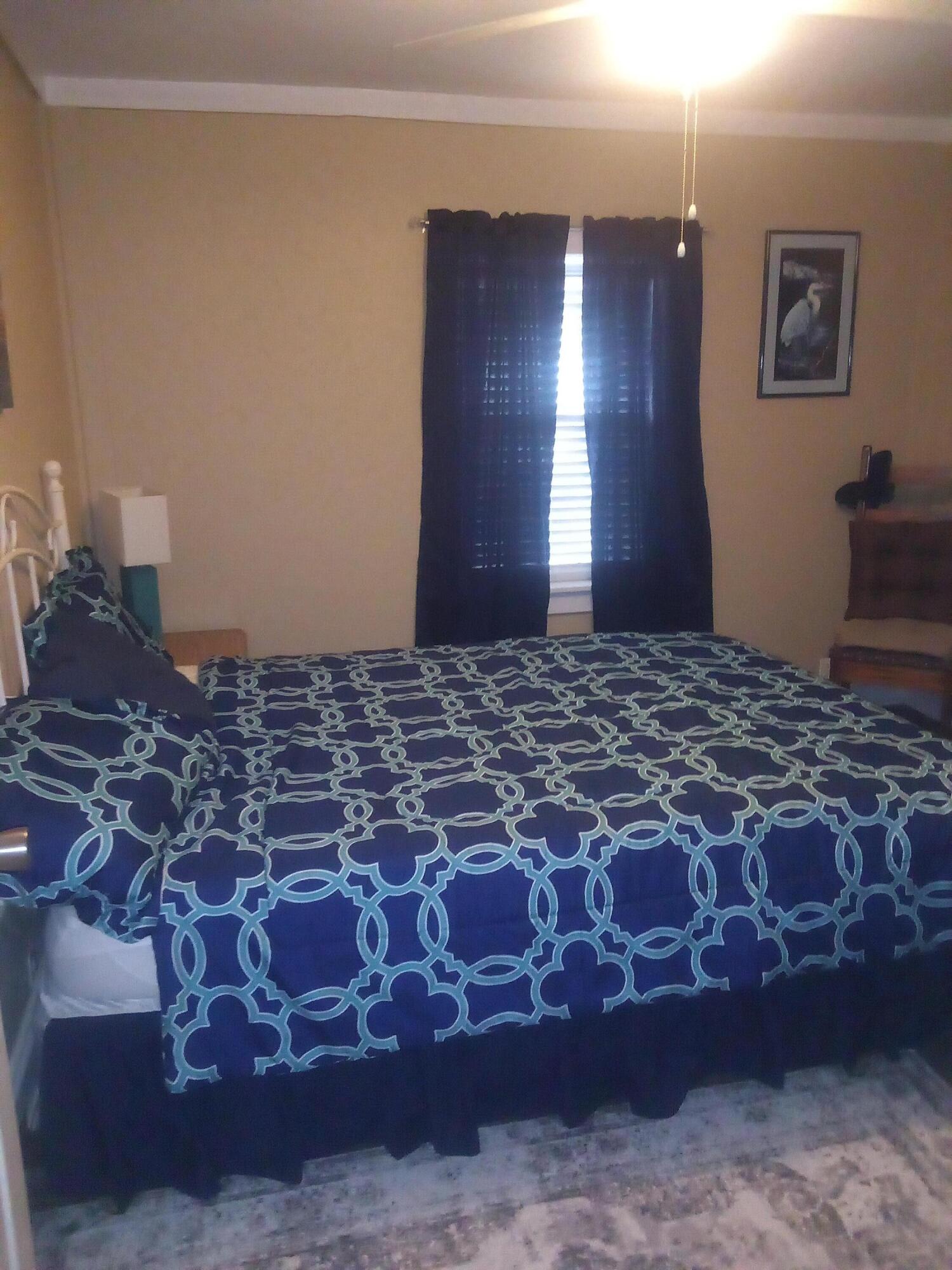 7363 Beaver Creek Road Baker, FL 32531 - Photo 6 of 29 a large bed in a room