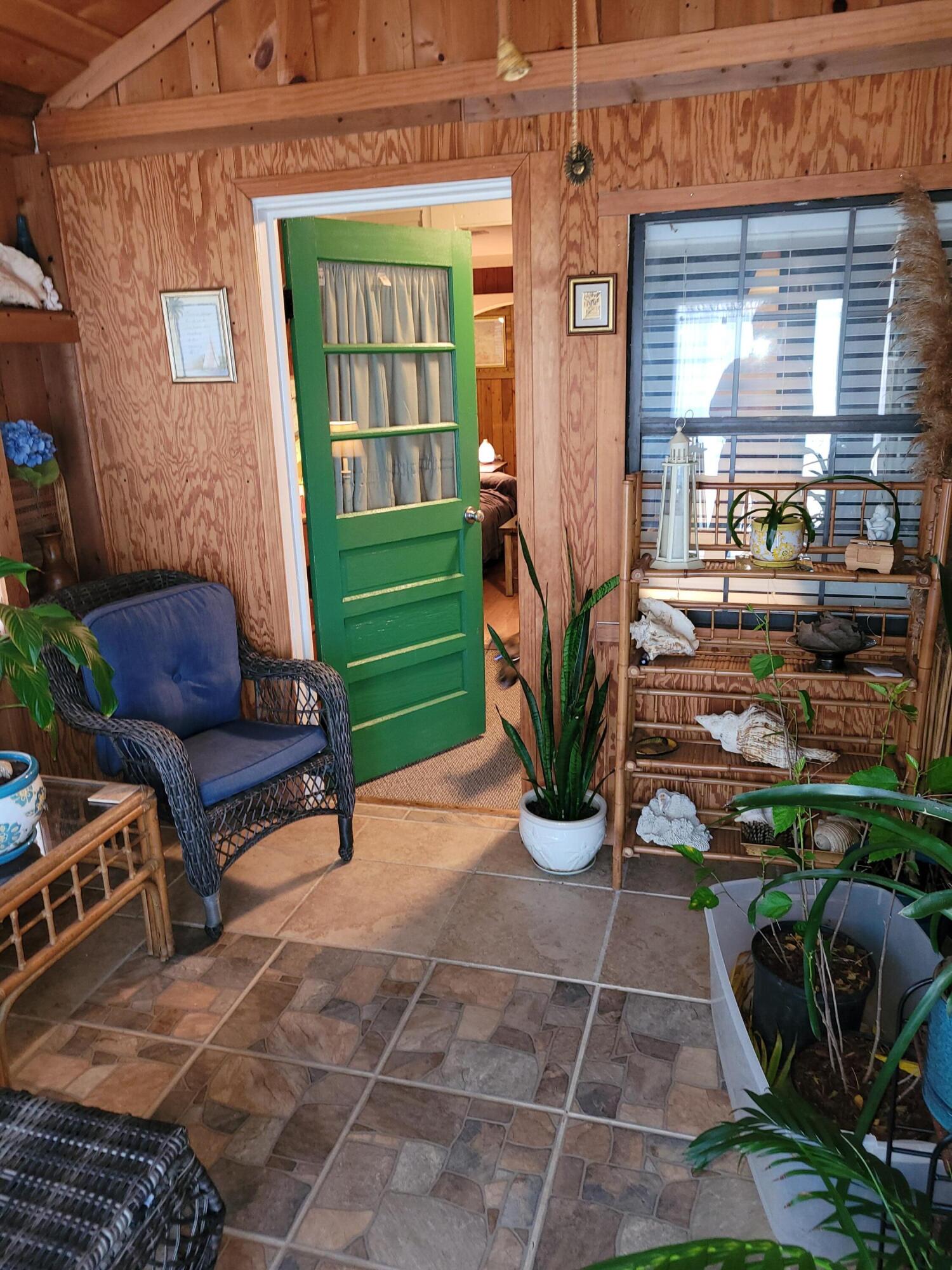 7363 Beaver Creek Road Baker, FL 32531 - Photo 8 of 29 a building outdoor space with patio furniture and potted plants