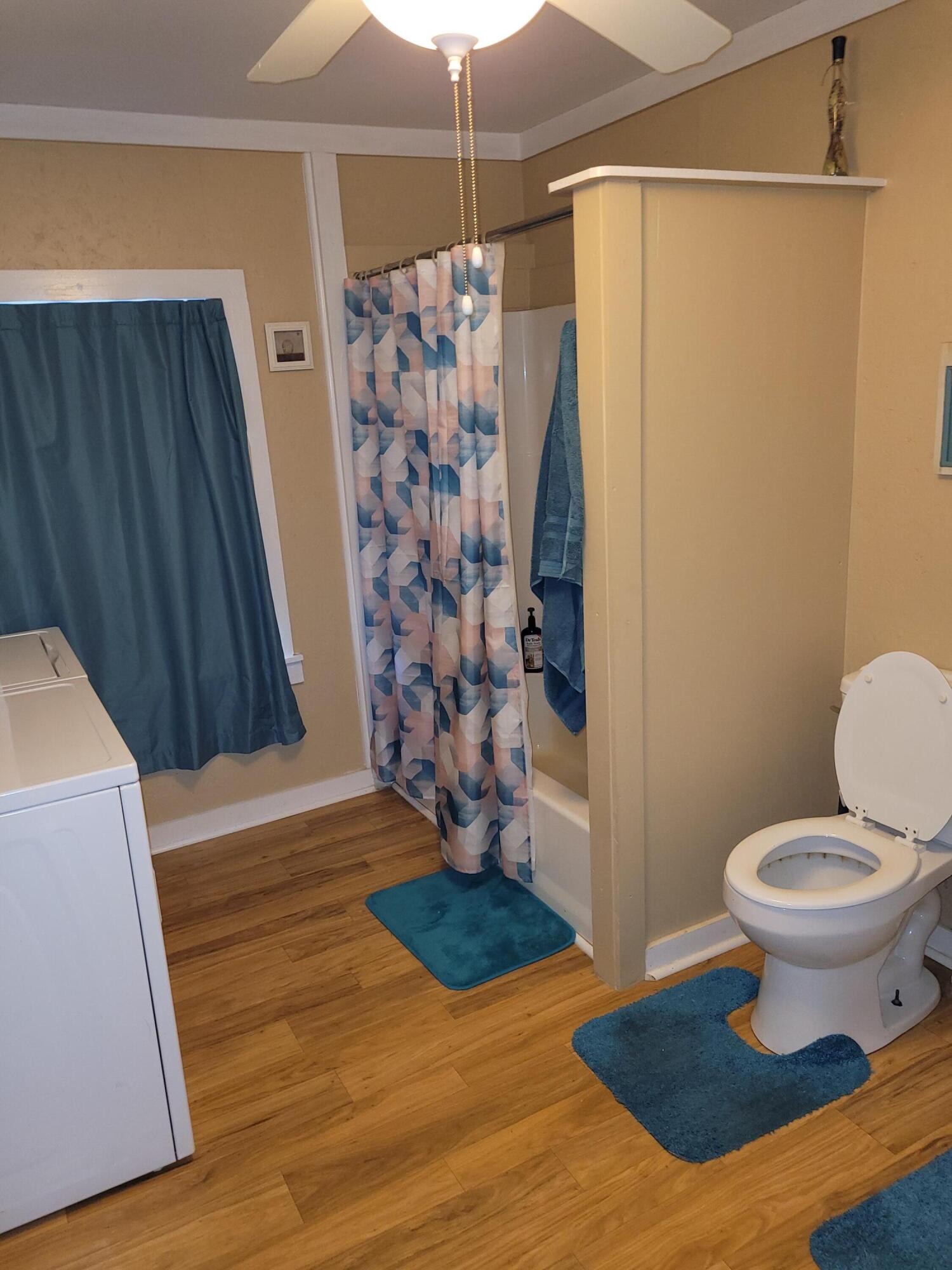 7363 Beaver Creek Road Baker, FL 32531 - Photo 9 of 29 a view of bathroom with a shower and a toilet
