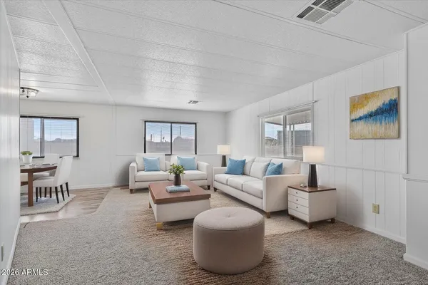 a living room with furniture and a table