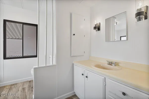 a bathroom with a sink and a mirror