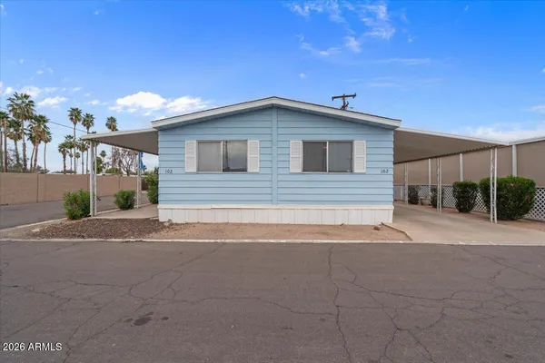 a view of a house with a yard and garage