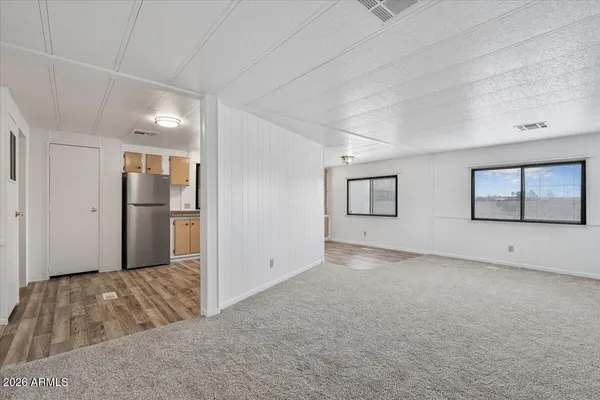 a view of livingroom with an empty room