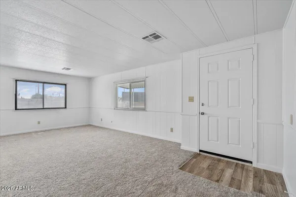 a view of an empty room with a window