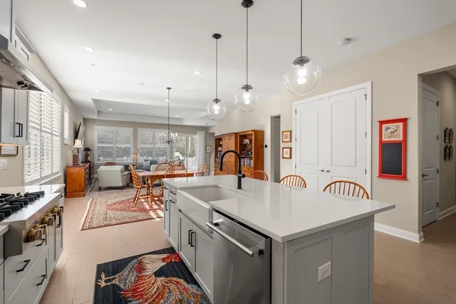 a very nice looking kitchen with a large window and stainless steel appliances