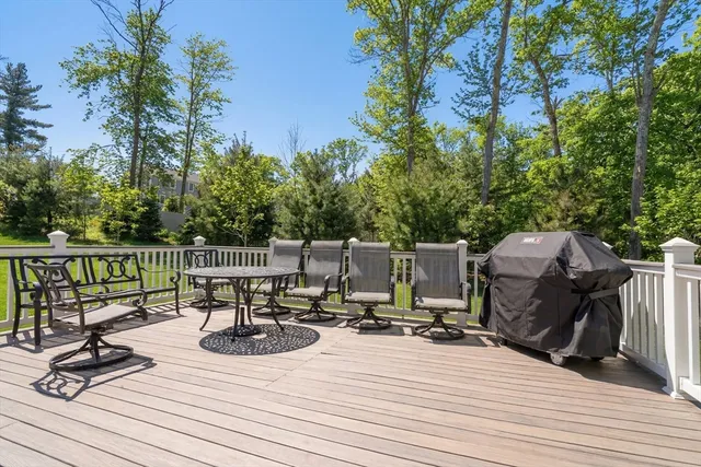 a view of table and chairs on wooden floor