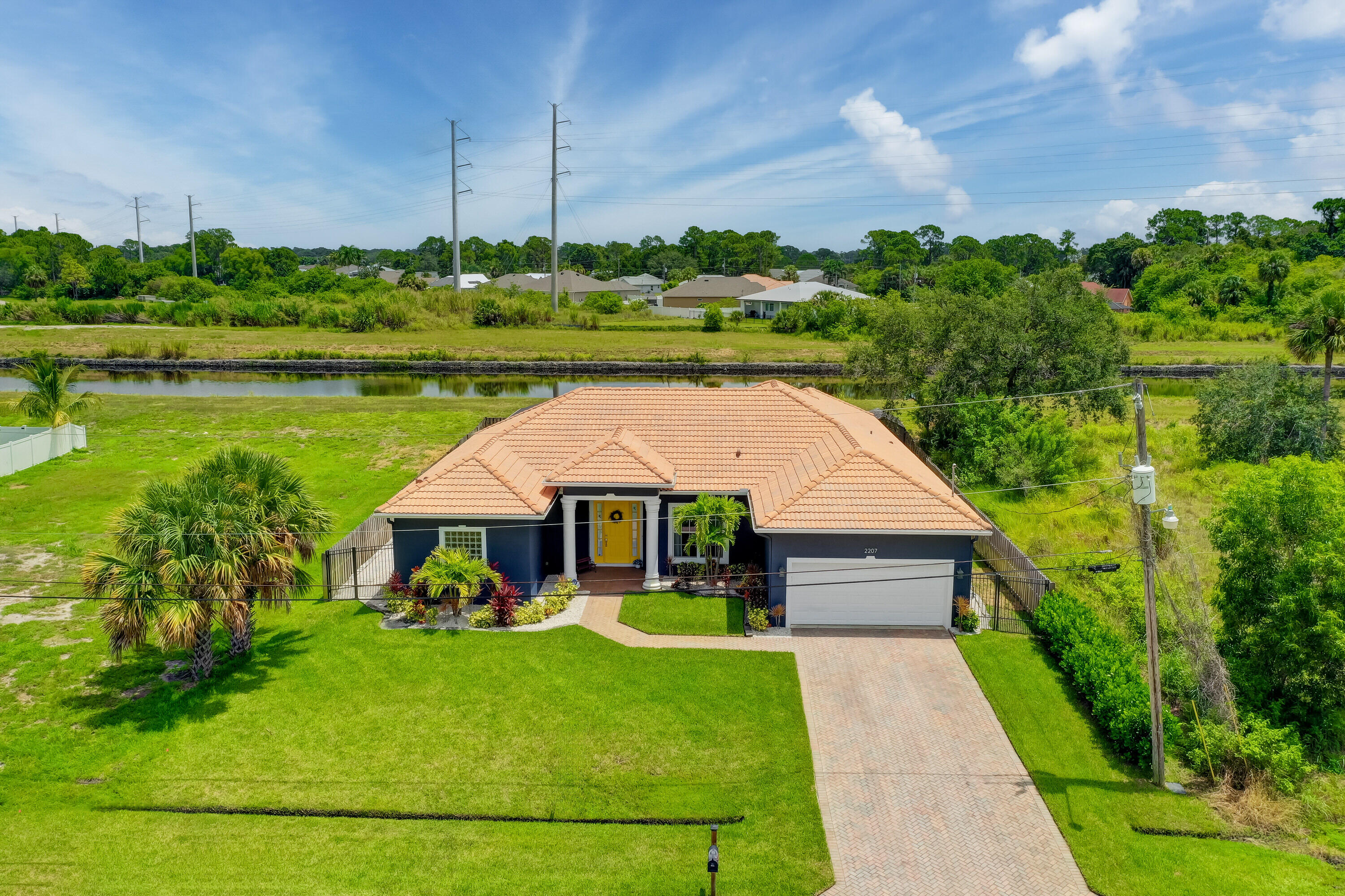 2207 Southwest Salmon Road Port St. Lucie, FL 34953 - Photo 3 of 38 aerial front w canal