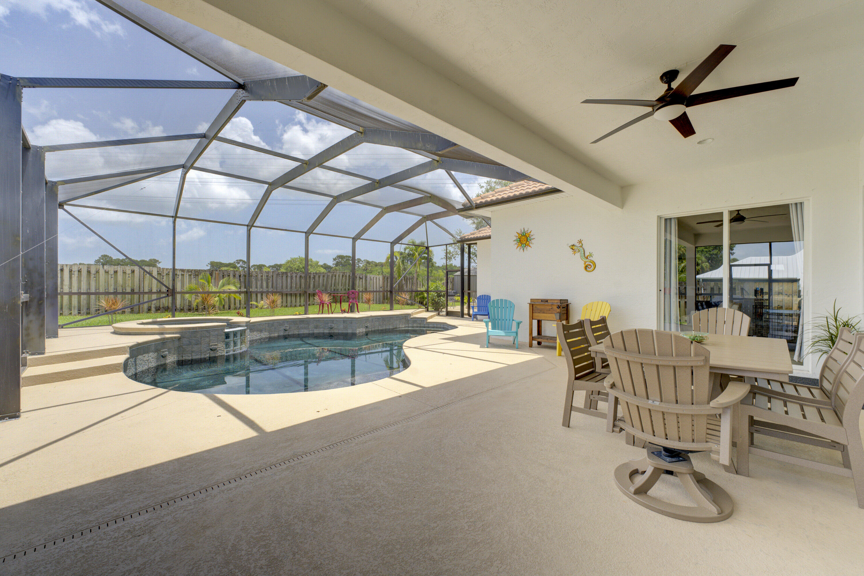 2207 Southwest Salmon Road Port St. Lucie, FL 34953 - Photo 35 of 38 pool-back patio toward family room