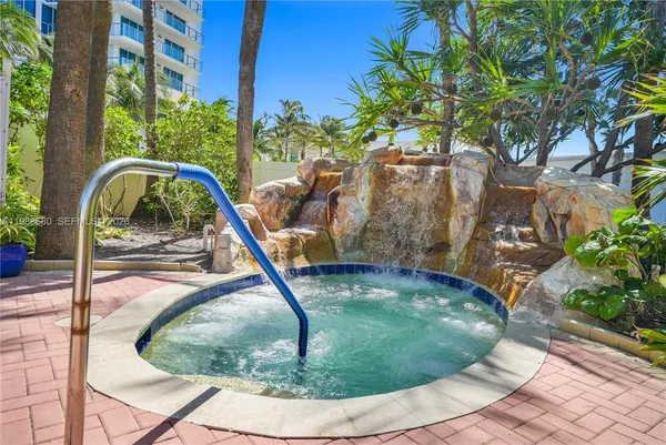 a view of a workspace with a table and chairs